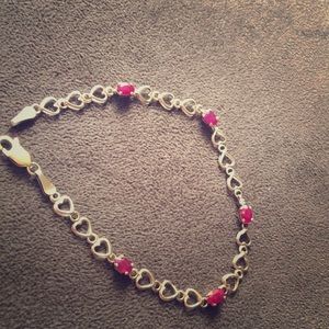 10k yellow gold heart bracelet with rubies